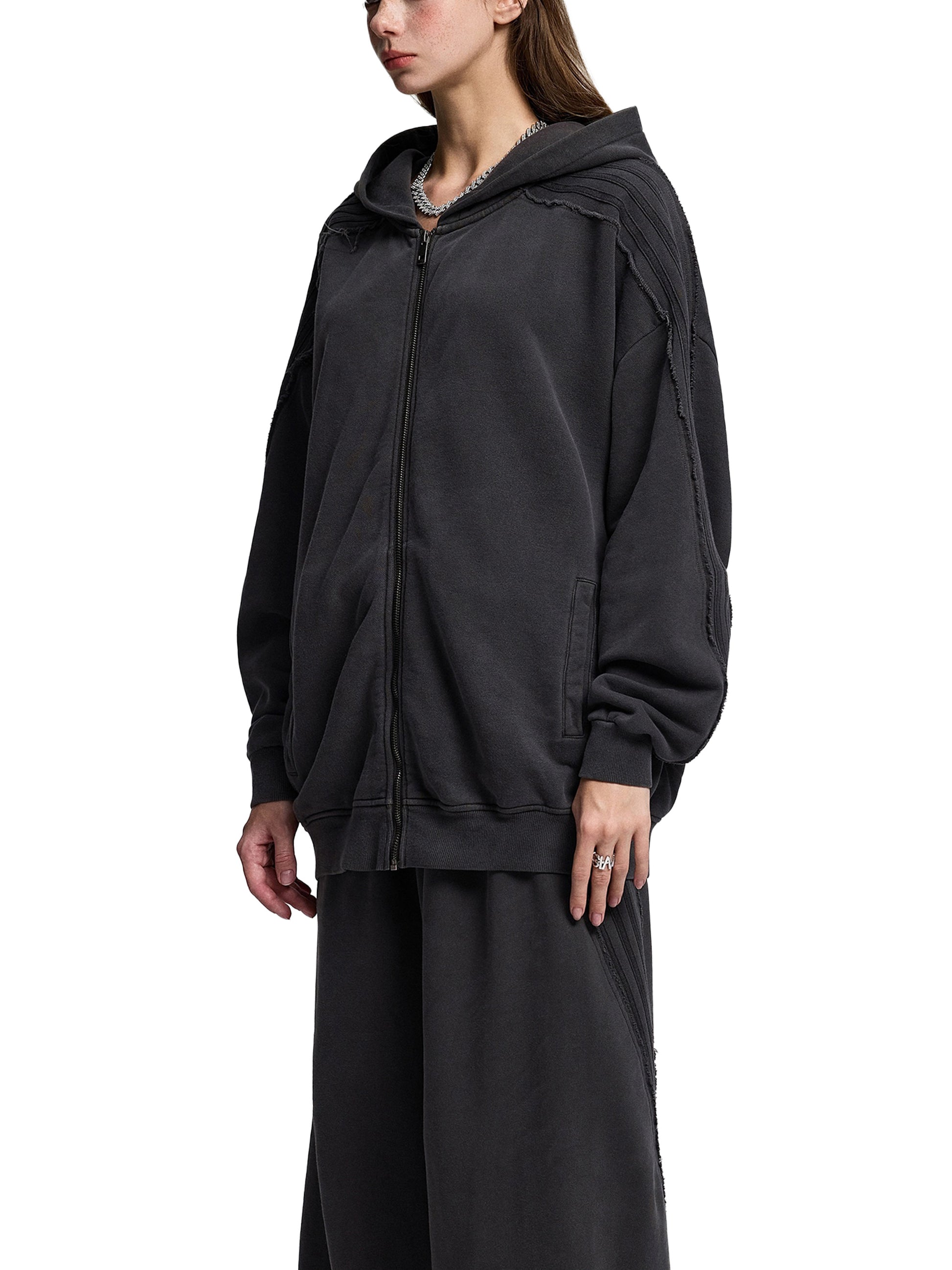 Snow Washed Tape Raw Edge Zip Hoodie by ODMPOD, showing front view with raw edges, tape detailing, and zipper closure.
