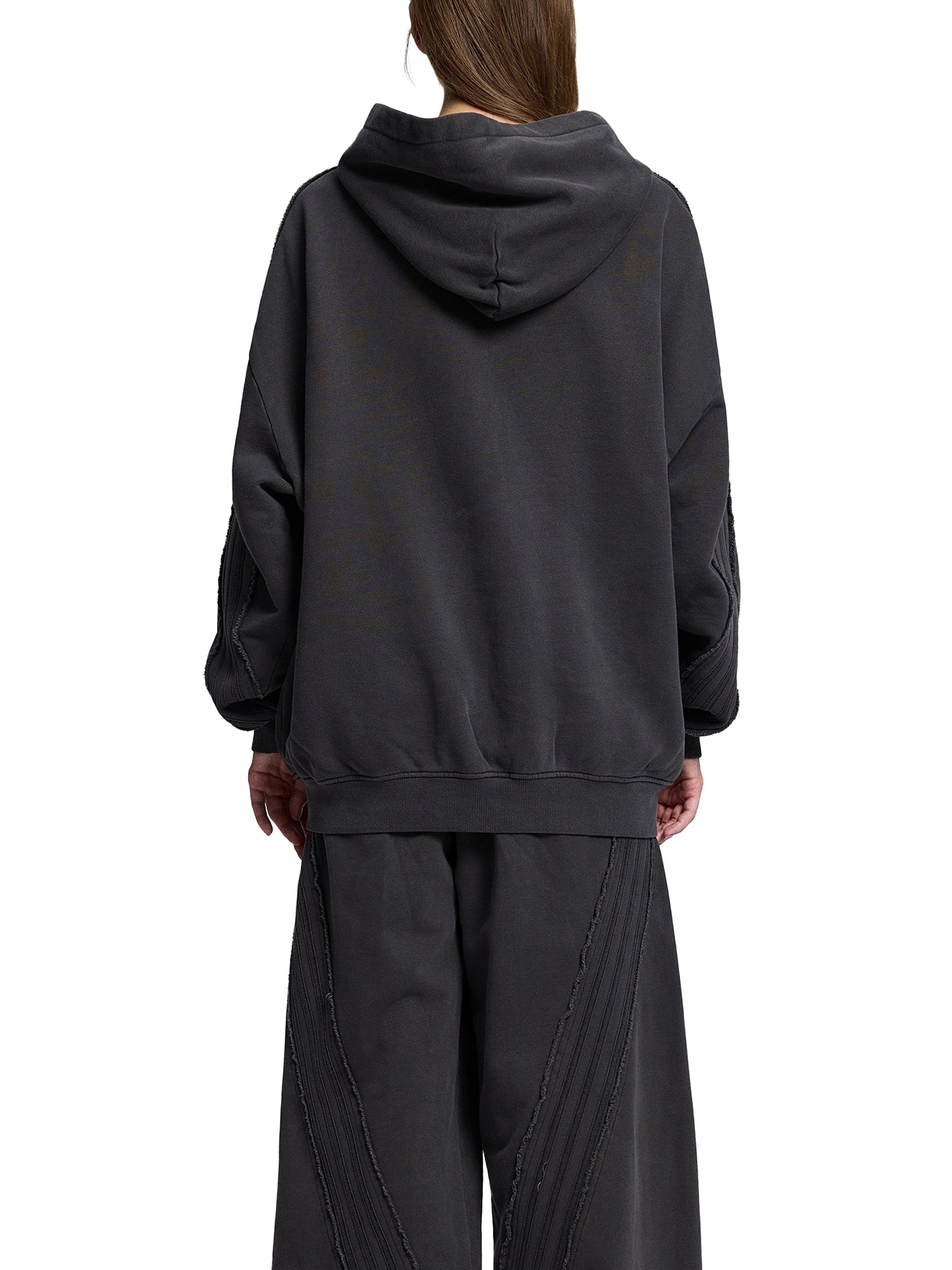 Snow Washed Tape Raw Edge Zip Hoodie by ODMPOD, showing the hoodie with raw edge details and front zipper design.