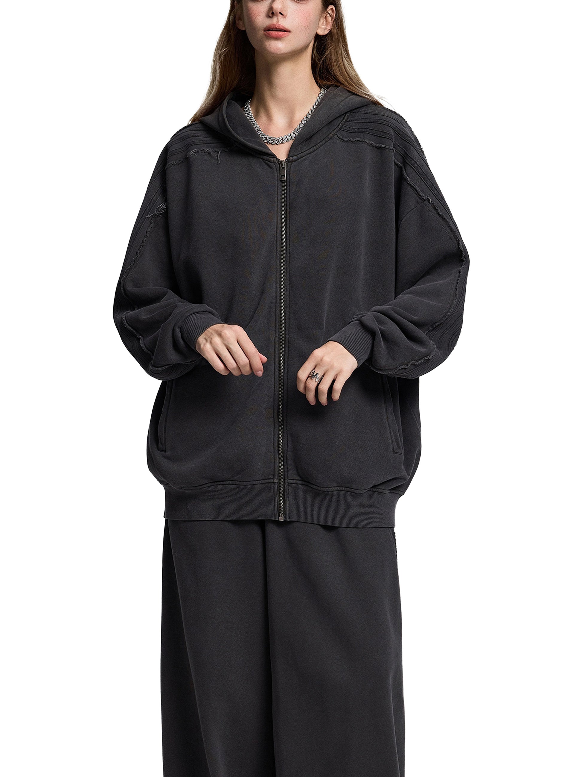 ODMPOD Snow Washed Tape Raw Edge Zip Hoodie, front view showing distressed raw edge details and full-length zipper.