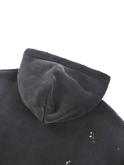 Vintage washed frayed fleece hoodie by ODMPOD, showing the soft, distressed fabric and relaxed fit with frayed edges.