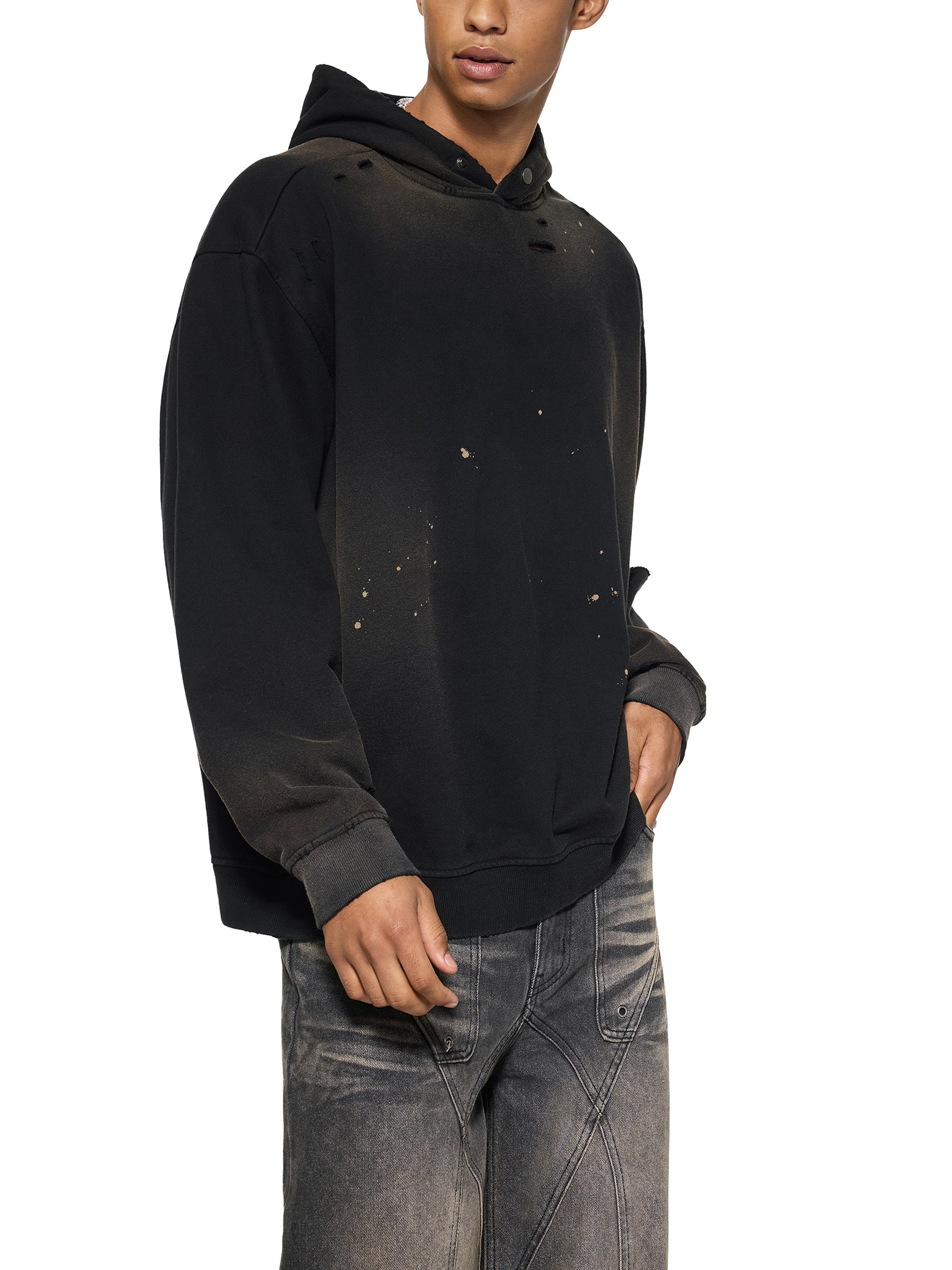 ODMPOD Sun Fade Frayed Fleece Hoodie showing a relaxed fit with faded sun-inspired design and frayed hem detail.