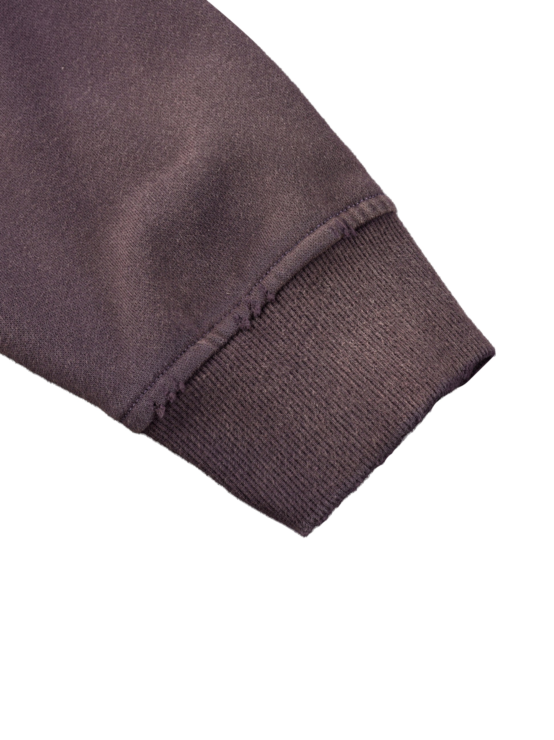 ODMPOD Sun Fade Frayed Fleece Hoodie showing distressed fabric, frayed edges, and relaxed fit in a cozy, sun-washed style.