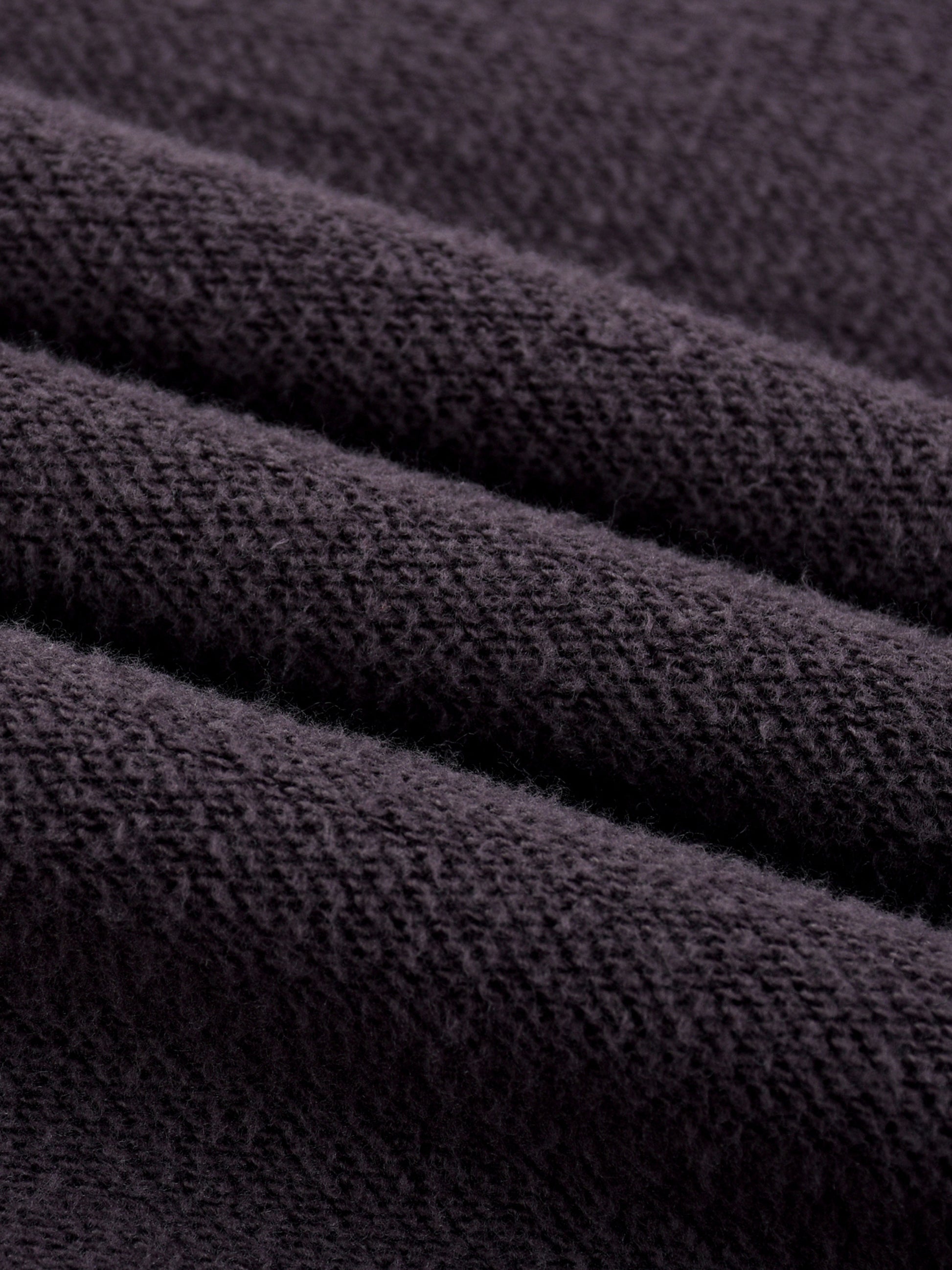 ODMPOD Sun Fade Frayed Fleece Hoodie showing distressed fabric, frayed edges, and a relaxed fit in a cozy fleece material.