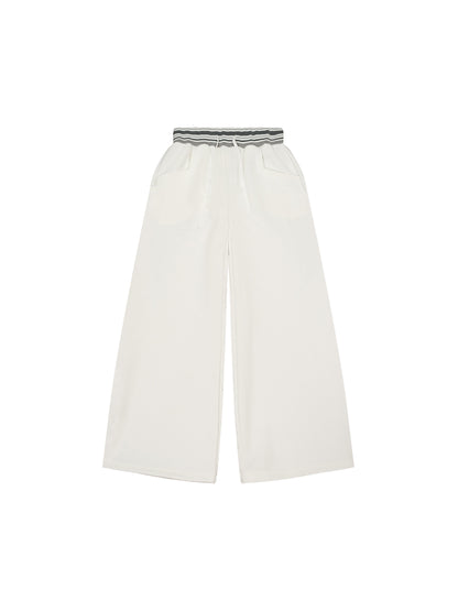 ODMPOD striped waist wide-leg pants showing a high-waisted design with vertical black and white stripes.