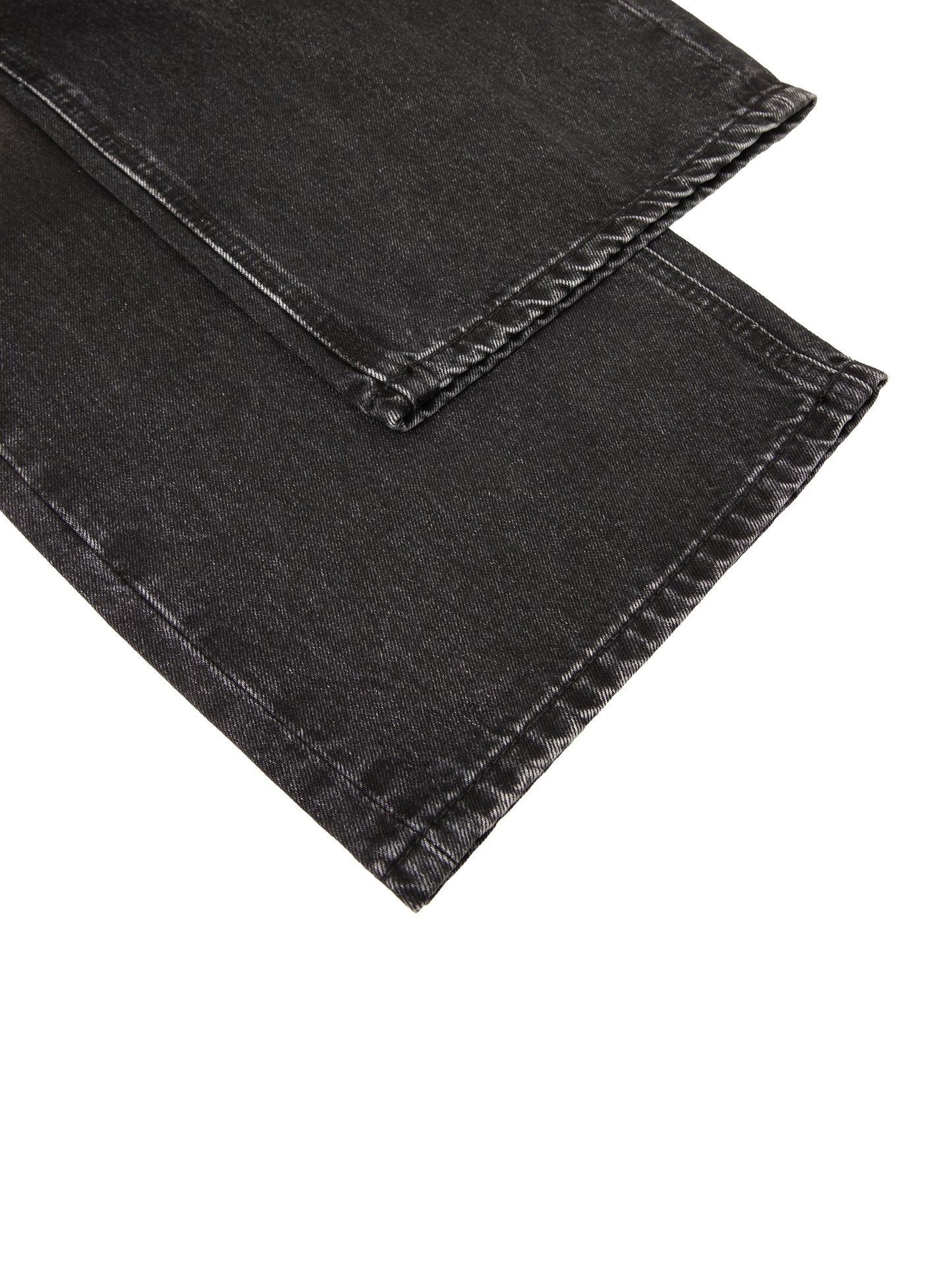 Vintage wash heavyweight denim jeans by ODMPOD, showing classic fit and distressed details in a natural pose.