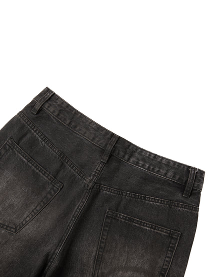 Vintage wash heavyweight denim jeans by ODMPOD, showing classic fit and rugged texture in a close-up shot.