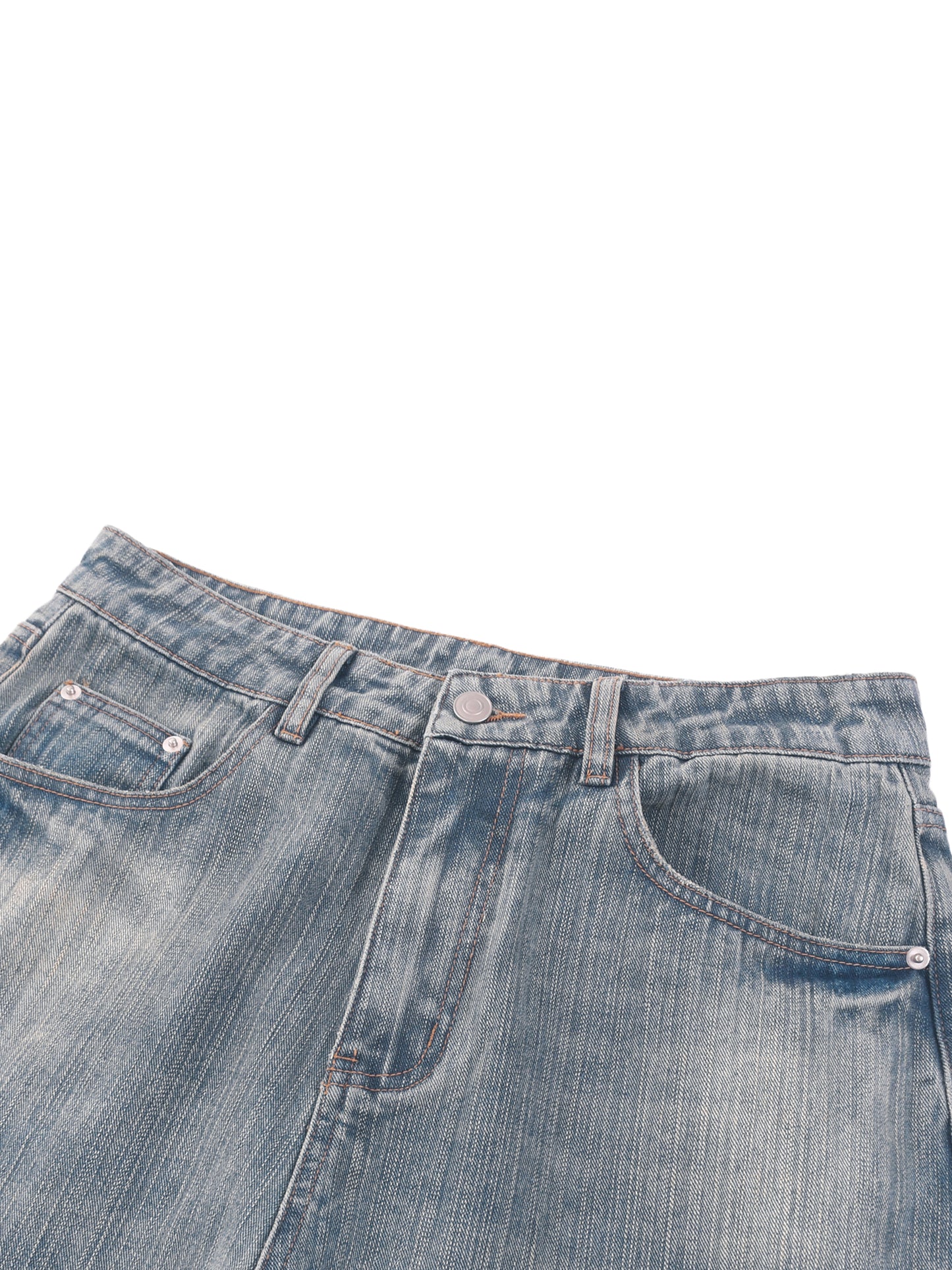 Vintage wash distressed denim jeans by ODMPOD, showing a close-up of the faded, torn fabric and classic jean details.