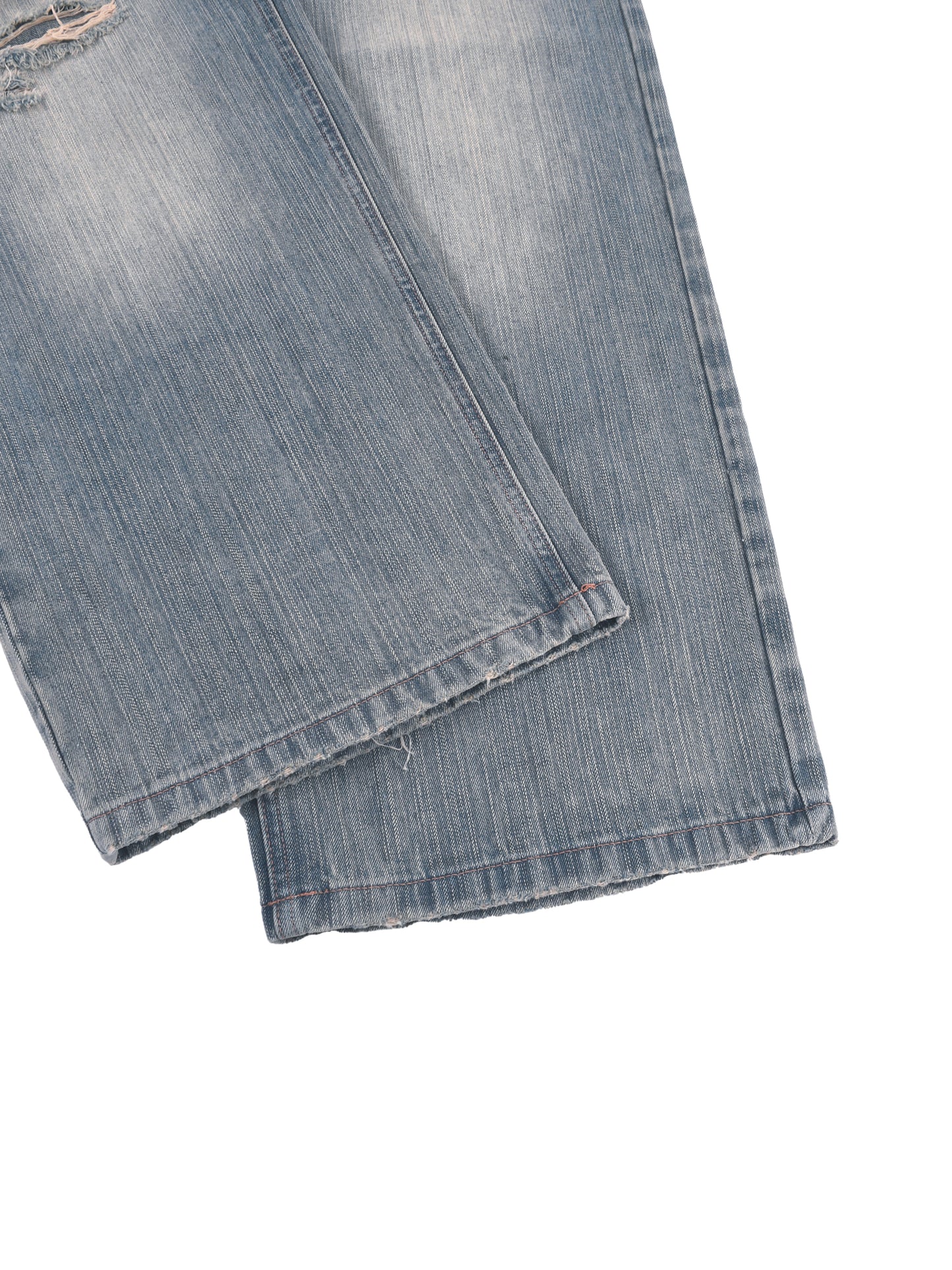 Vintage wash distressed denim jeans from ODMPOD featuring faded and ripped details, classic five-pocket style, and relaxed fit.