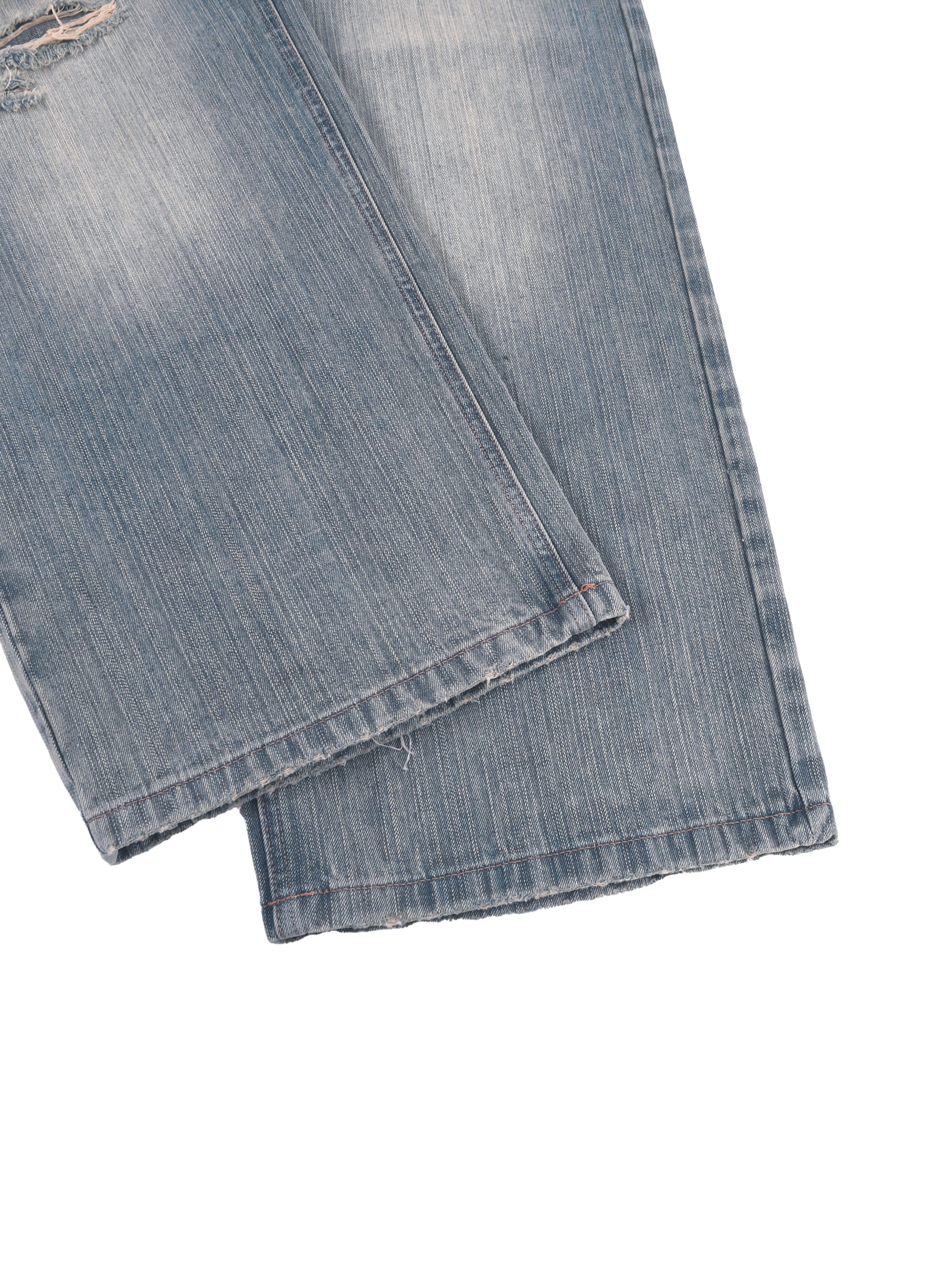 Vintage wash distressed denim jeans from ODMPOD featuring faded and ripped details, classic five-pocket style, and relaxed fit.
