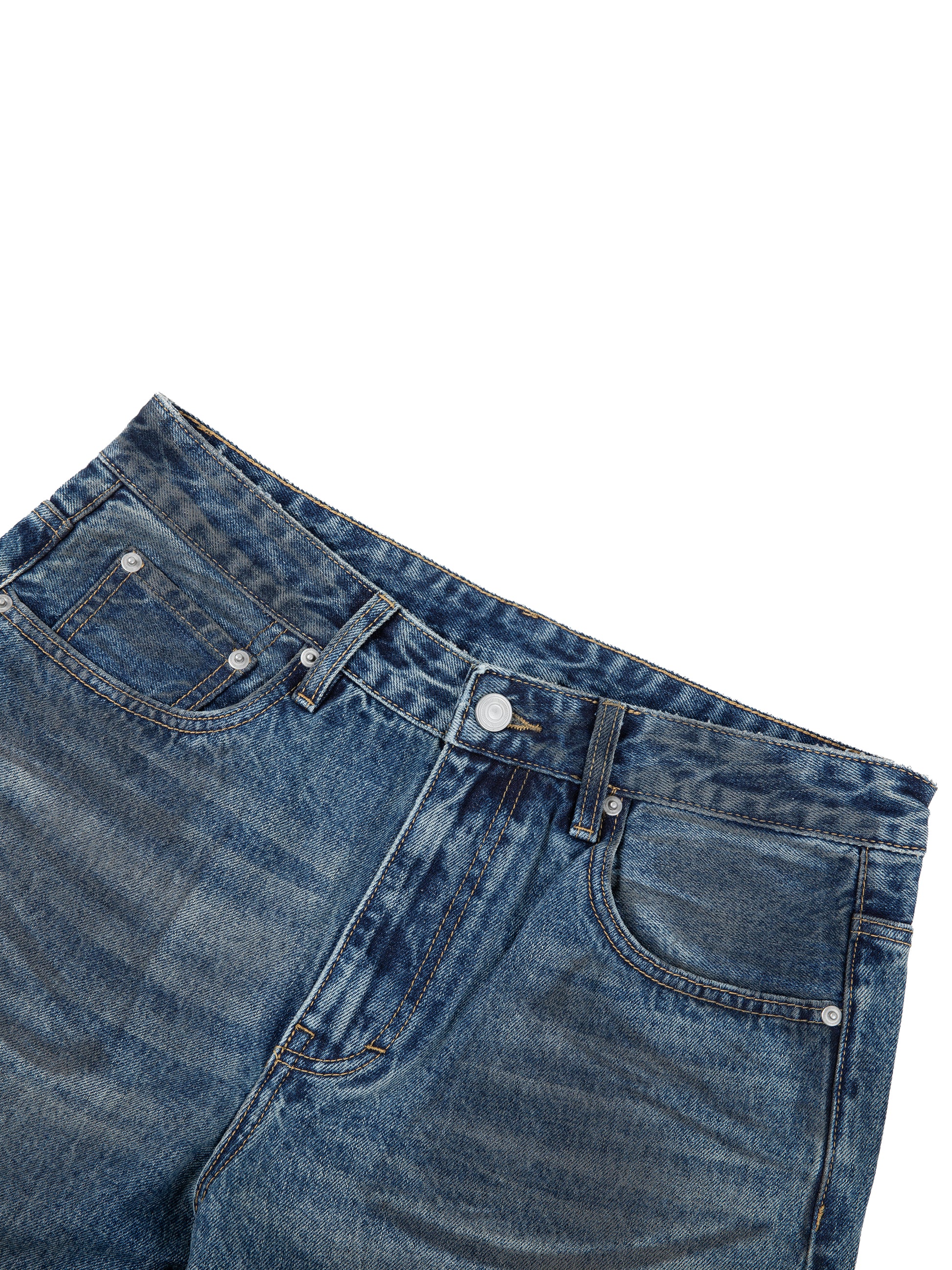 Vintage wash baggy denim jeans by ODMPOD, showing relaxed fit and classic denim texture.