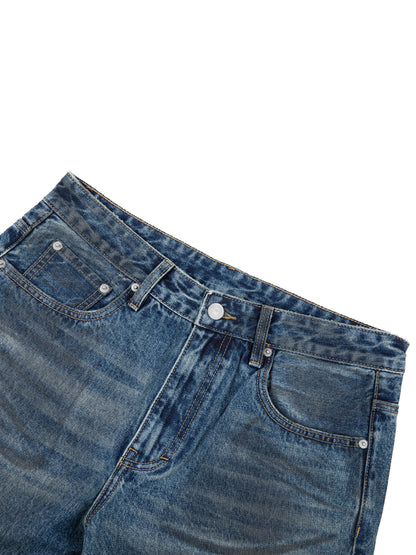 Vintage wash baggy denim jeans by ODMPOD, showing relaxed fit and classic denim texture.