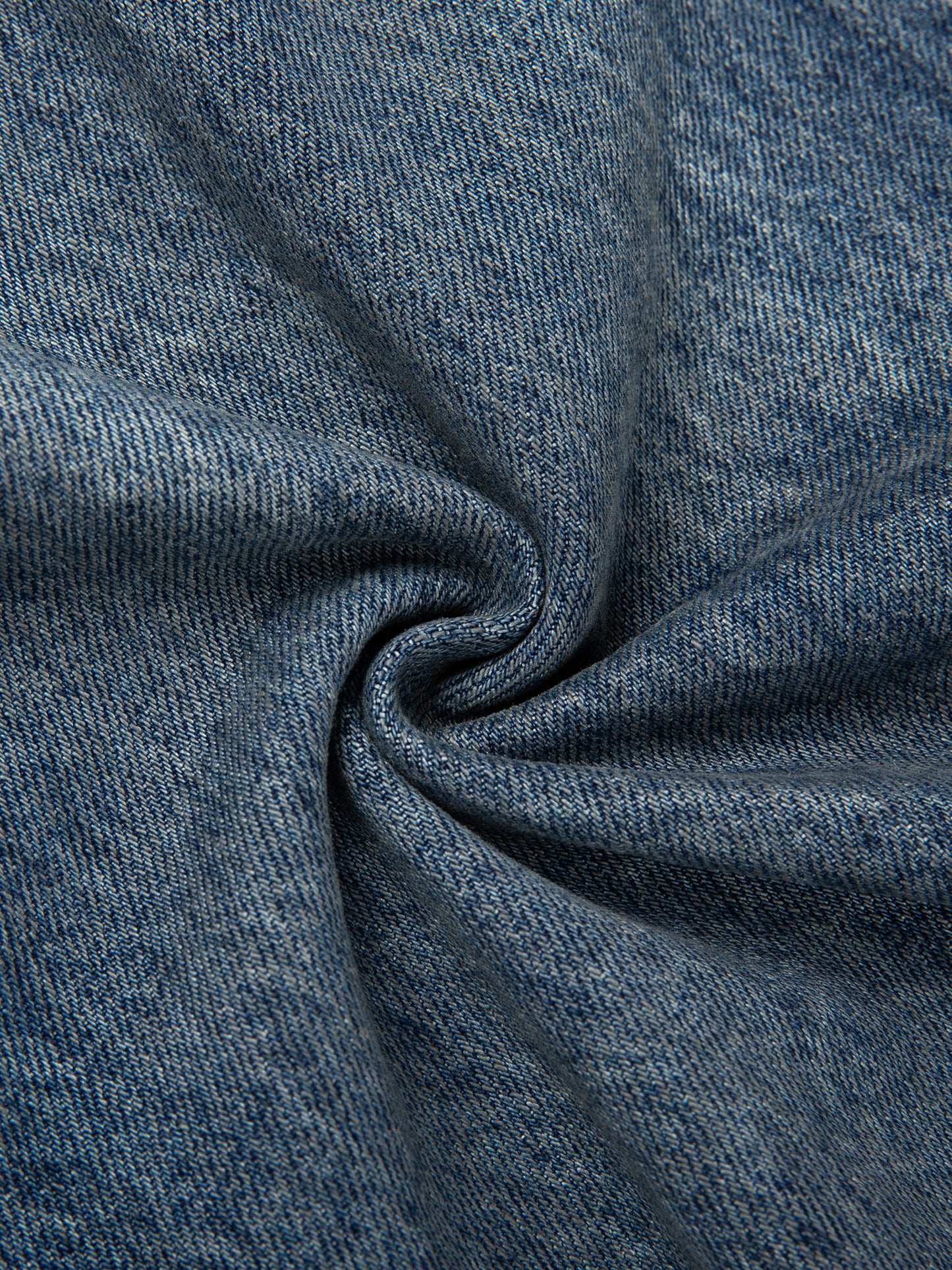 Vintage wash baggy denim jeans by ODMPOD, showing the relaxed fit and classic denim texture.