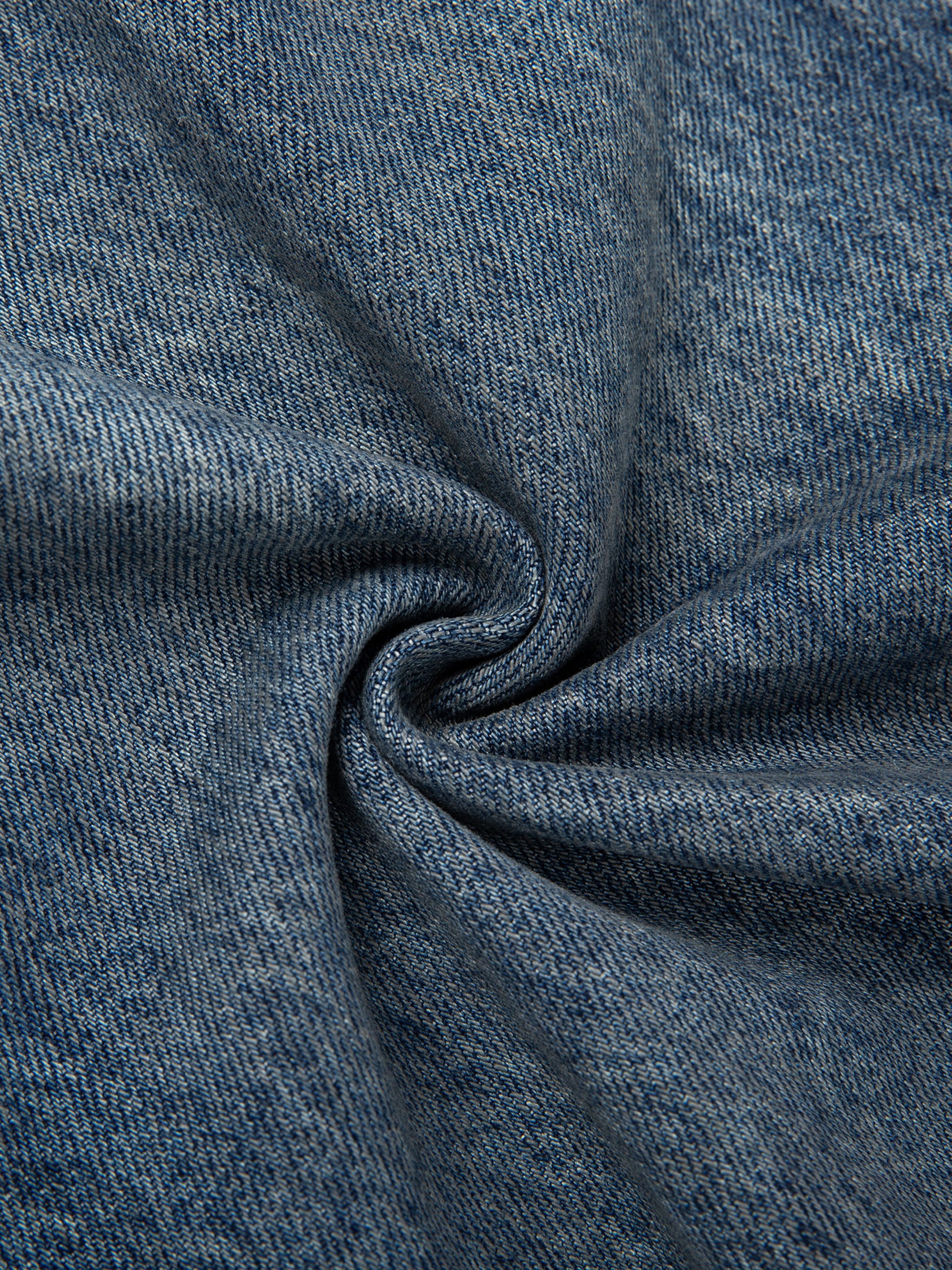 Vintage wash baggy denim jeans by ODMPOD, showing the relaxed fit and classic denim texture.