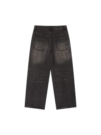 Vintage wash heavyweight denim jeans by ODMPOD, featuring classic fit and distressed details on a model.