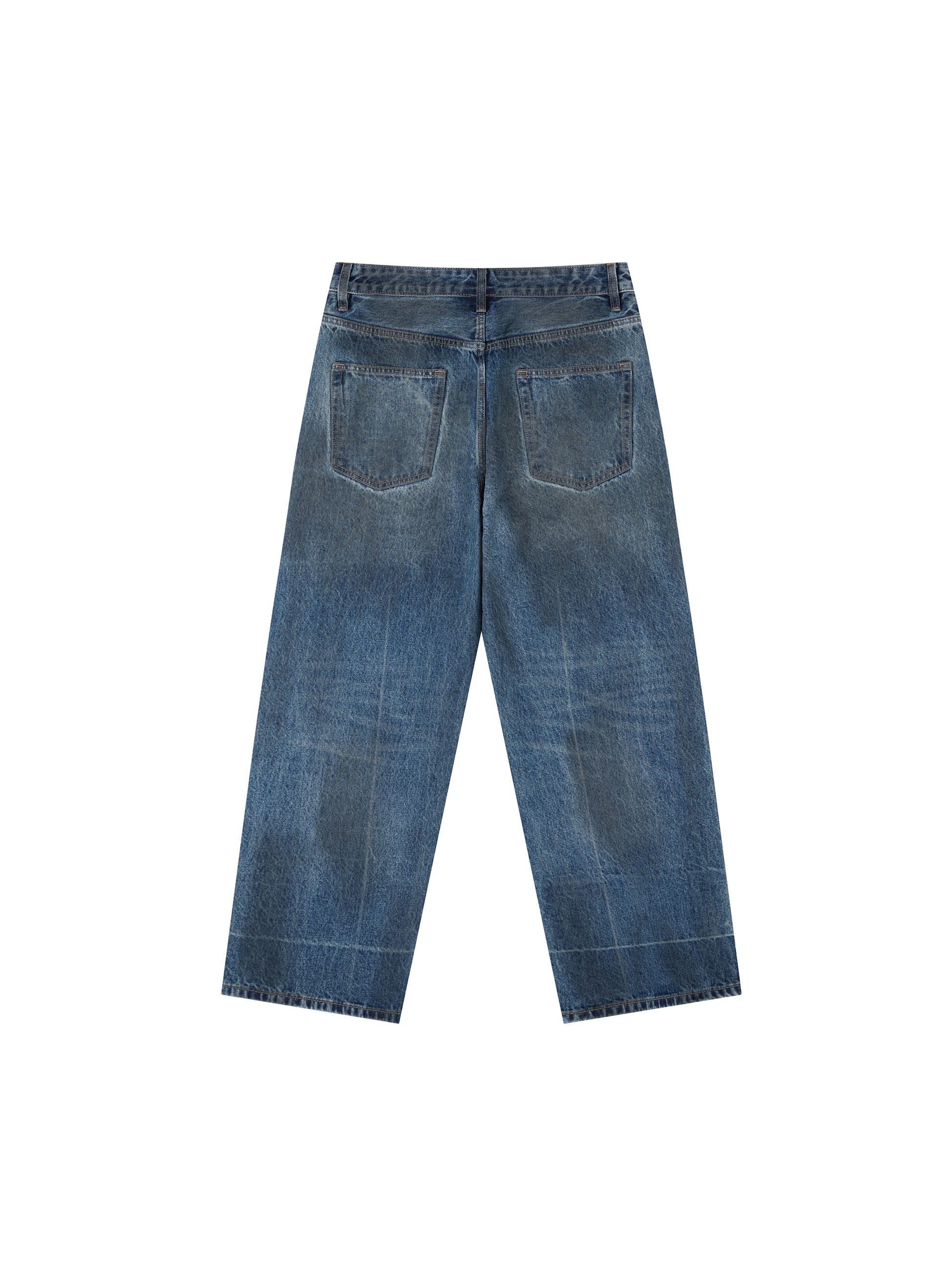 Vintage wash baggy denim jeans by ODMPOD, showing relaxed fit with faded blue denim and classic five-pocket design.