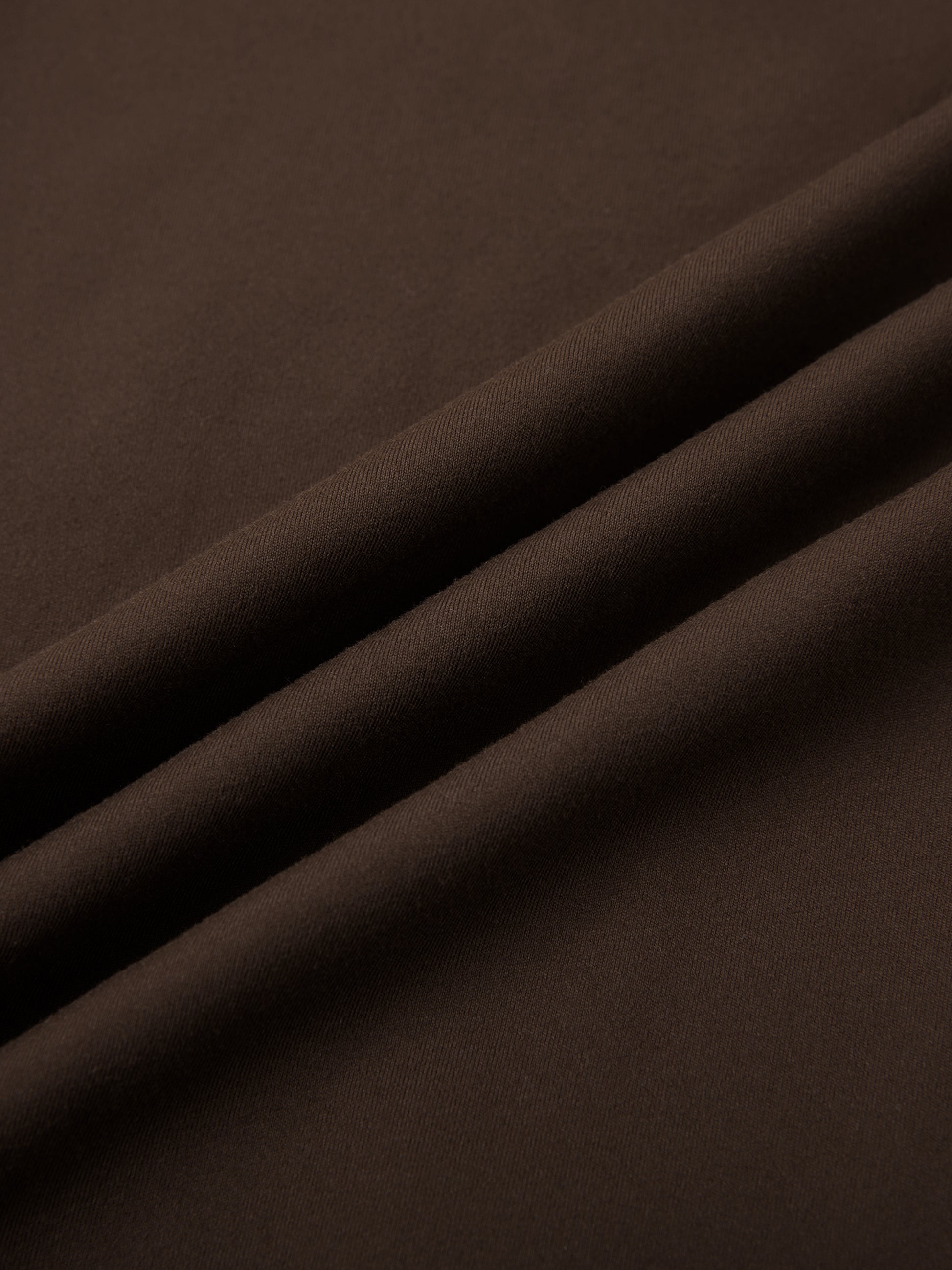 High-waisted ODMPOD yoga leggings in black shown on a model, highlighting stretch and fit for active wear.