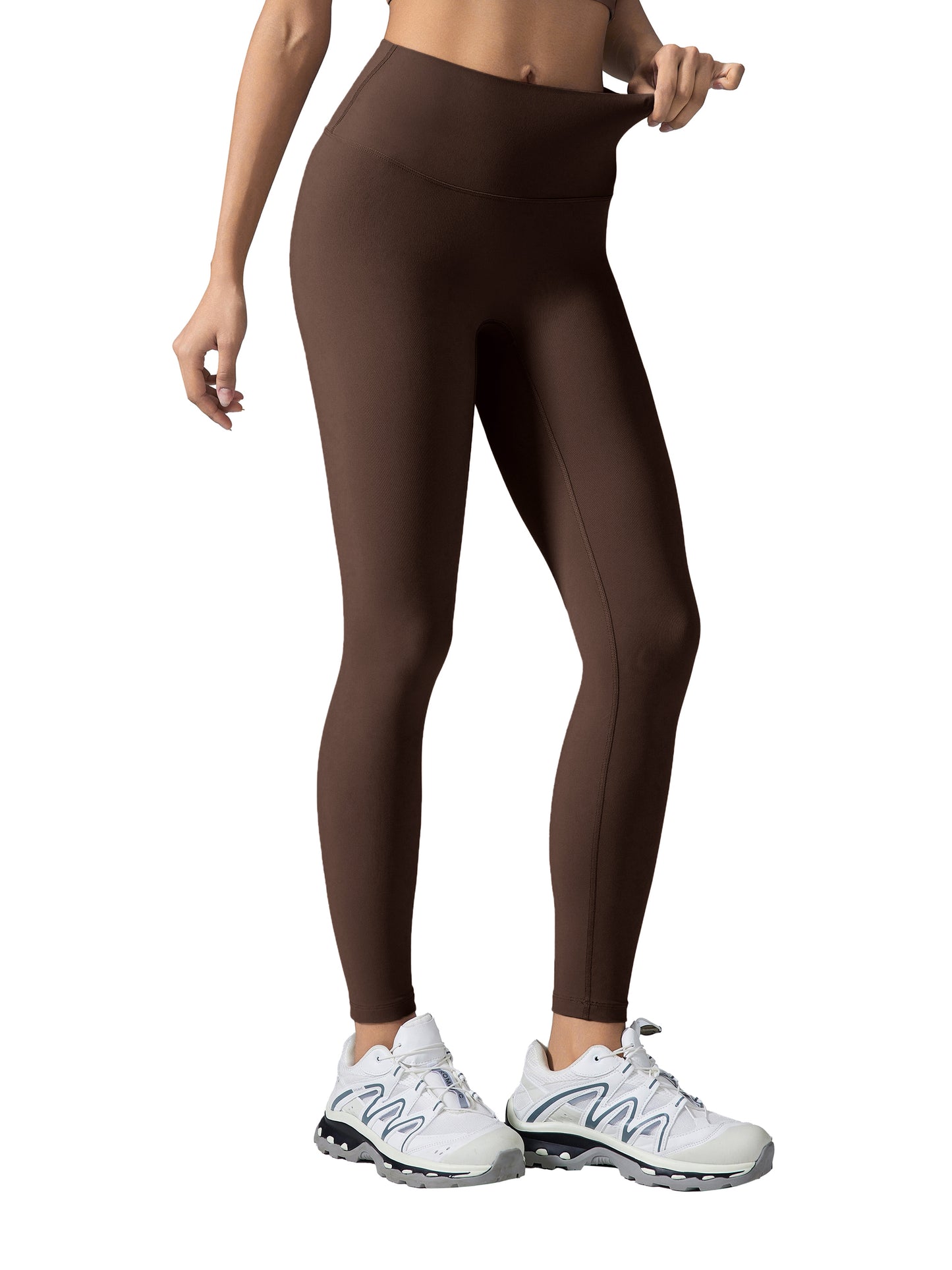 ODMPOD high-waisted yoga leggings in black, showing a close-up view of the stretchy, comfortable fabric and fit.