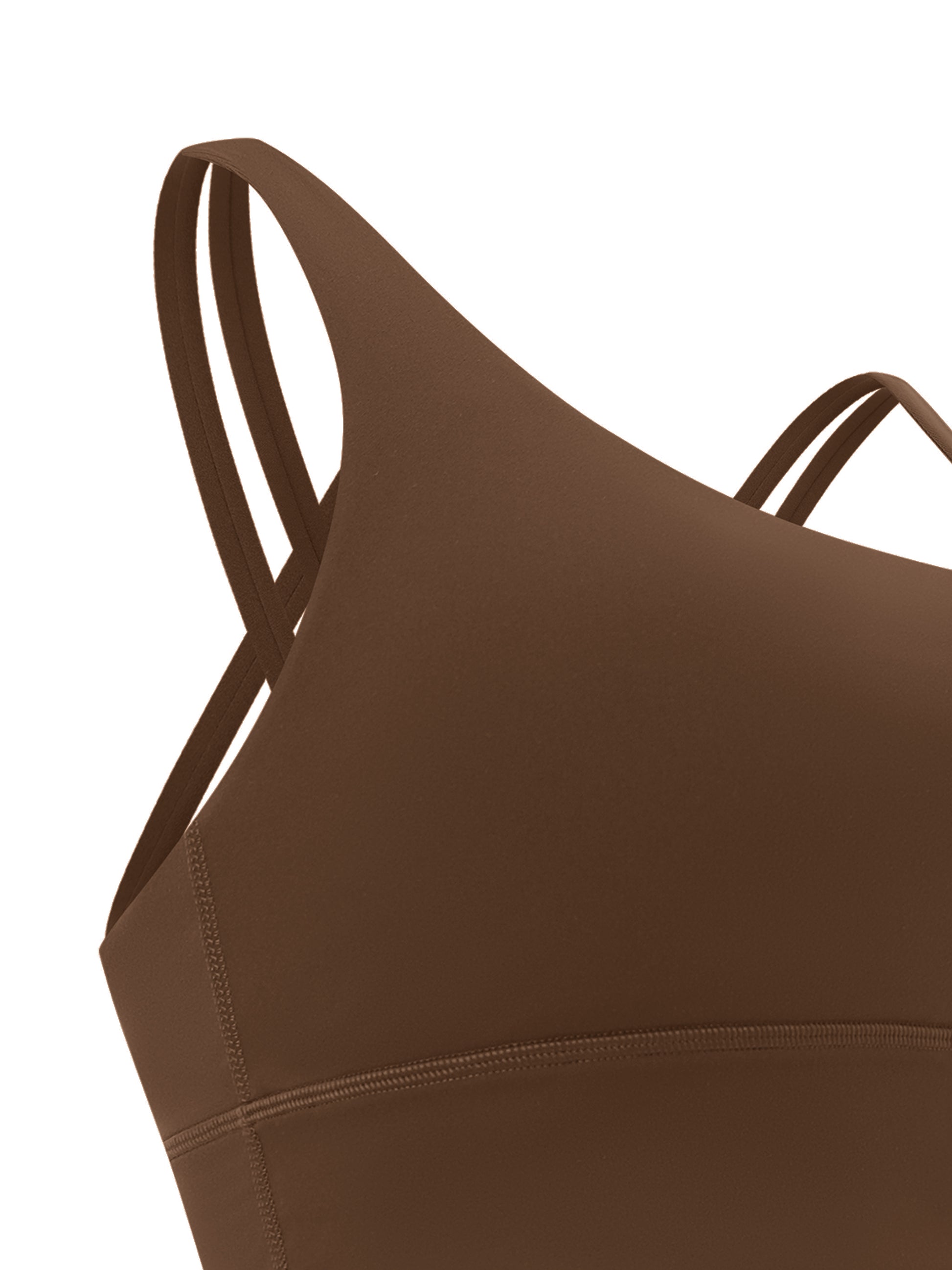 ODMPOD strappy criss-cross sports bra with supportive design and adjustable straps, shown on a neutral background.