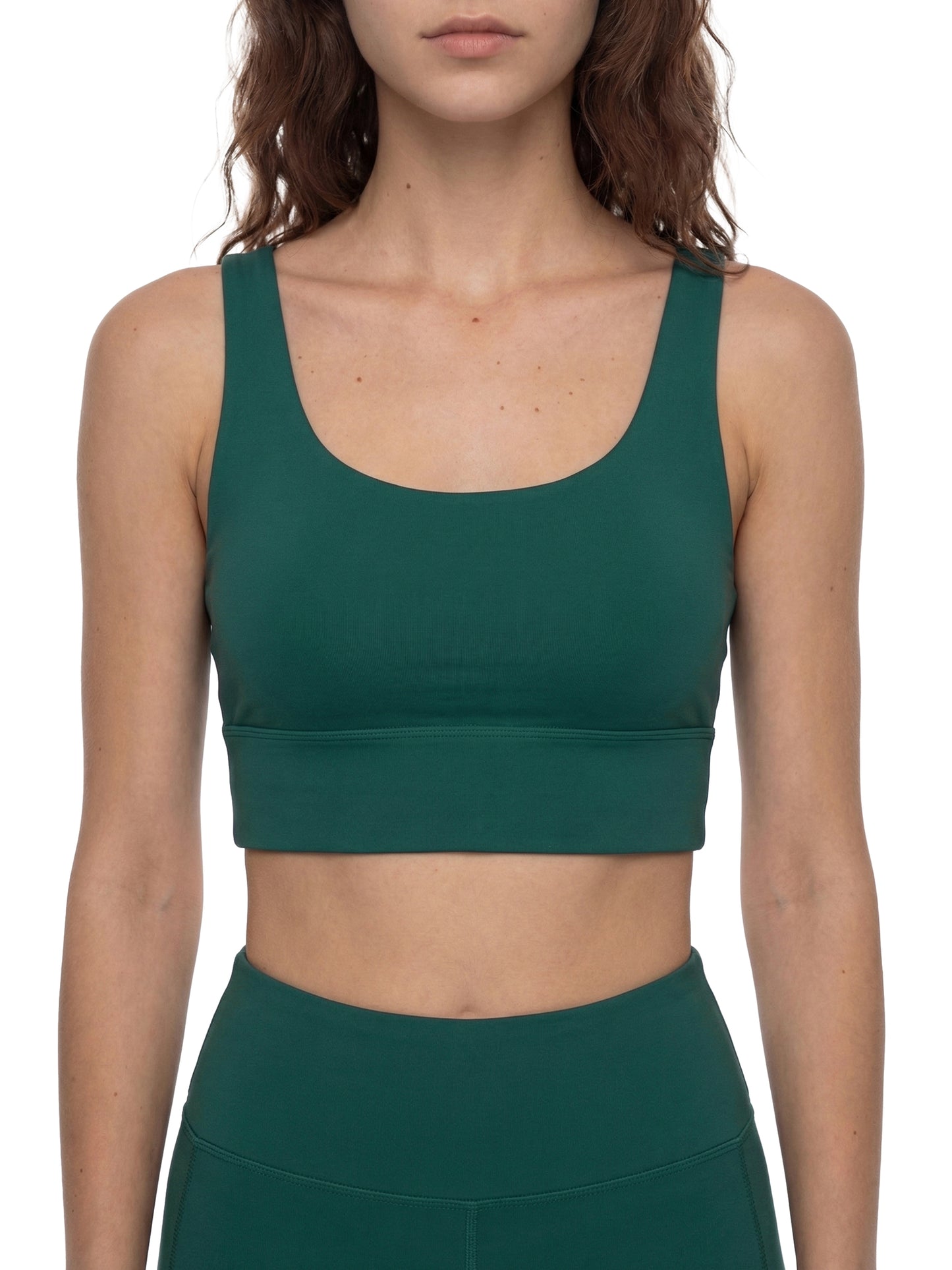 ODMPOD strappy criss-cross sports bra with adjustable straps, designed for support and style during workouts.