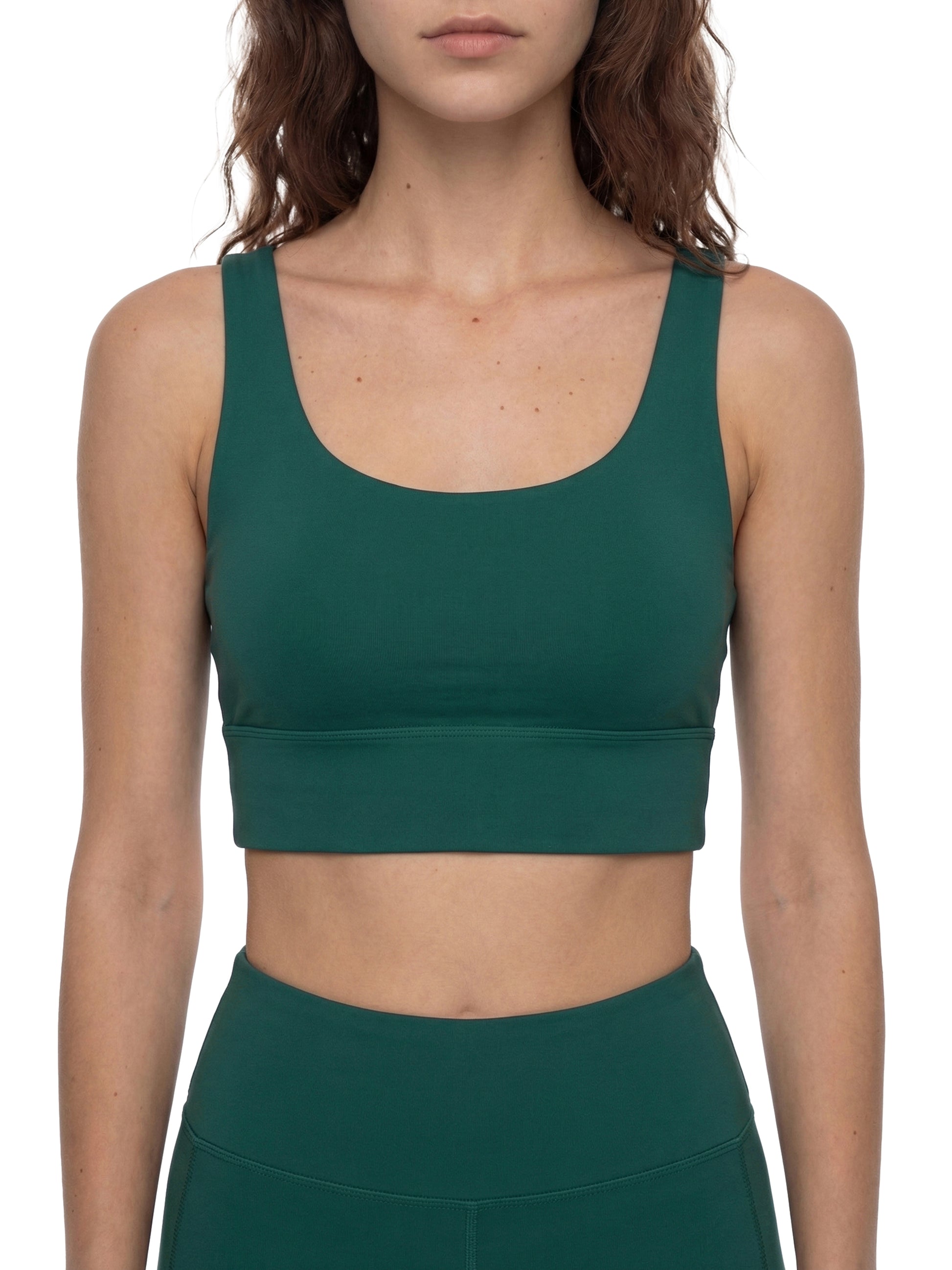 ODMPOD strappy criss-cross sports bra with adjustable straps, designed for support and style during workouts.